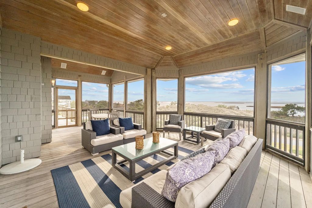 The Estate in Duck provides plenty of space for enjoying the sunrise over the ocean, now available for sale. This home located at 112 S Baum Trl, Duck, North Carolina