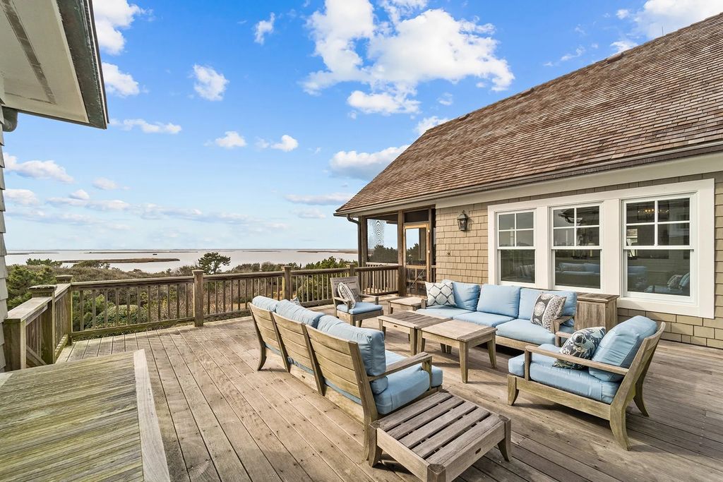 The Estate in Duck provides plenty of space for enjoying the sunrise over the ocean, now available for sale. This home located at 112 S Baum Trl, Duck, North Carolina