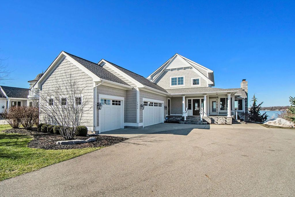The Estate in Holland is a luxurious home designed to maximize lake views and enhance outdoor enjoyment for your family and friends now available for sale. This home located at 1609 S Shore Dr, Holland, Michigan; offering 05 bedrooms and 05 bathrooms with 4,961 square feet of living spaces.