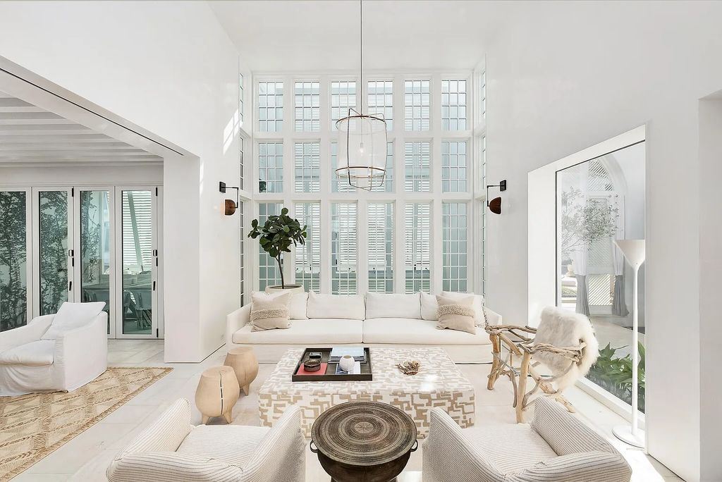 This stunning modernist retreat in the heart of Alys Beach, located at 116 S Charles Street, Inlet Beach, Florida, is a bespoke light-filled home with extraordinary architectural styling and sophisticated interior design.