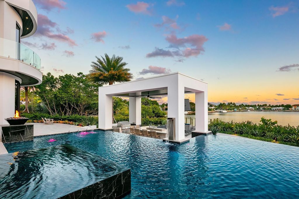 The Churchill Estate at 110 Churchill Way in Manalapan, Florida is a magnificent masterpiece of modern living. Built in 2021, this gated waterfront mansion boasts 6 bedrooms, 9 bathrooms, and over 15,000 square feet of living space on a 0.74-acre lot.