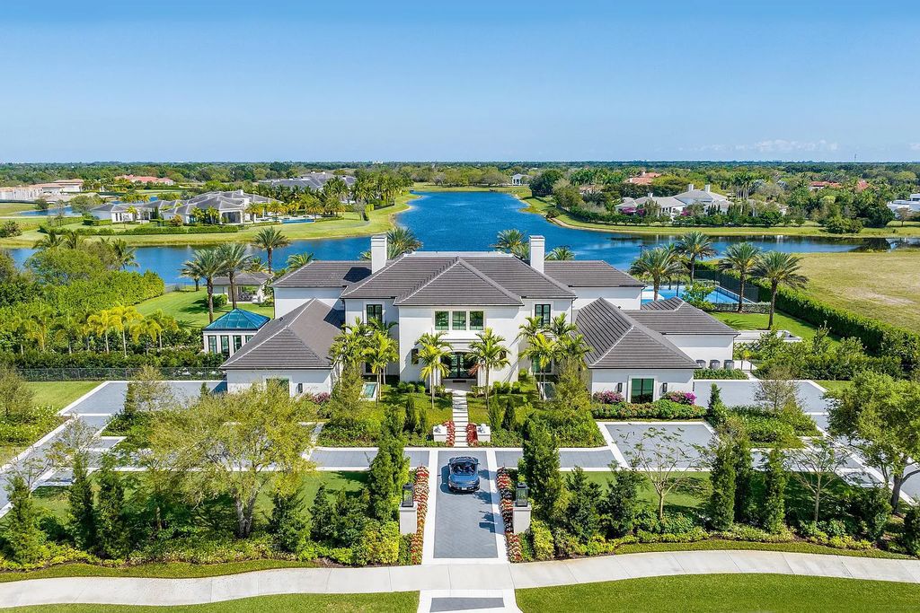 The Rosewood Estate at Stone Creek Ranch in Delray Beach, Florida is a stunning lakefront property offering 6 bedrooms, 10 baths, and over 11,000 square feet of luxurious living space on a 2.6-acre lot. 16071 Quiet Vista Circle features Georgian-inspired architecture and exquisite interior design by Marc-Michaels.
