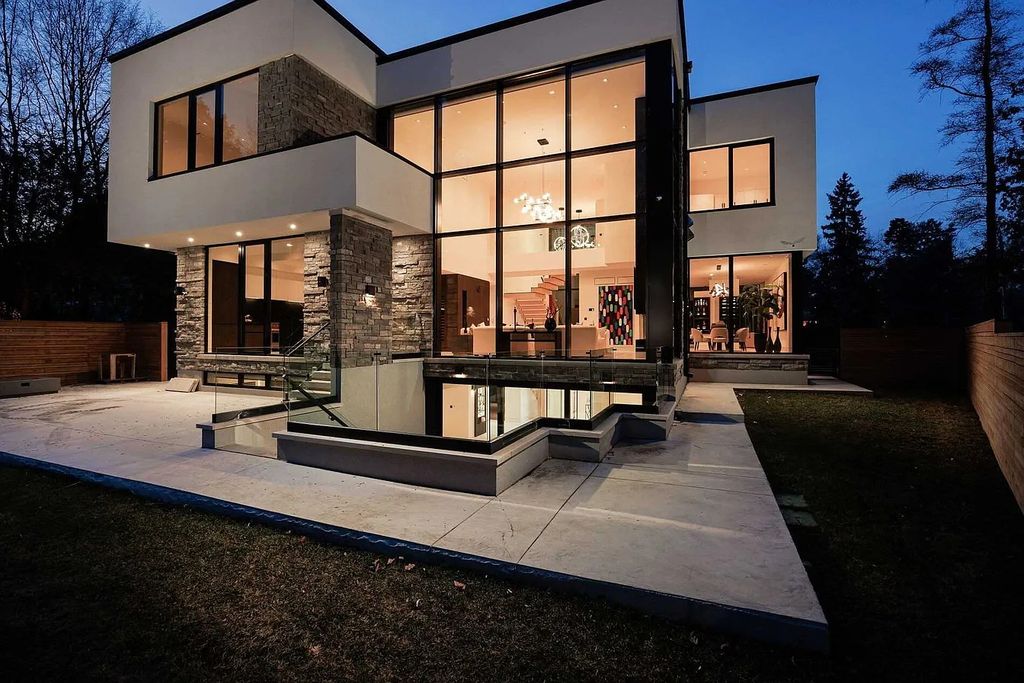 The Residence in Ontario boasts exceptional indoor-outdoor living through dramatic over-sized windows and an open floorplan, now available for sale. This home located at 2048 Ardleigh Rd, Oakville, ON L6J 1V6, Canada