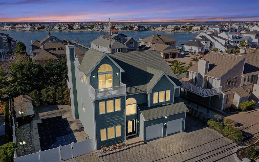 The Estate in Mantoloking is a luxurious home commanding breathtaking water views of the Atlantic Ocean and Barnegat Bay now available for sale. This home located at 377 Highway 35, Mantoloking, New Jersey; offering 04 bedrooms and 03 bathrooms with 3,110 square feet of living spaces.