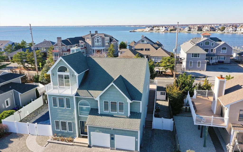 The Estate in Mantoloking is a luxurious home commanding breathtaking water views of the Atlantic Ocean and Barnegat Bay now available for sale. This home located at 377 Highway 35, Mantoloking, New Jersey; offering 04 bedrooms and 03 bathrooms with 3,110 square feet of living spaces.