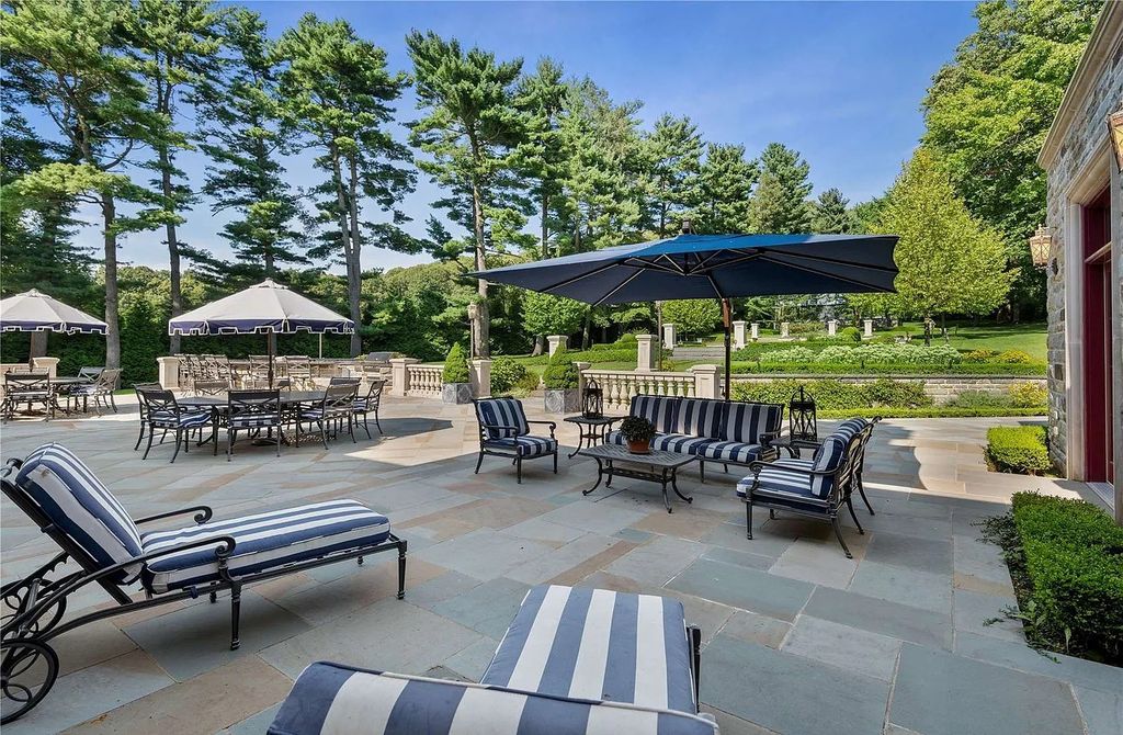 The Property in Mill Neck is a brand new estate complete with indoor pool, elegant pond, state of the art greenhouse and six-car garage, now available for sale. This home located at 102 Horseshoe Road, Mill Neck, New York