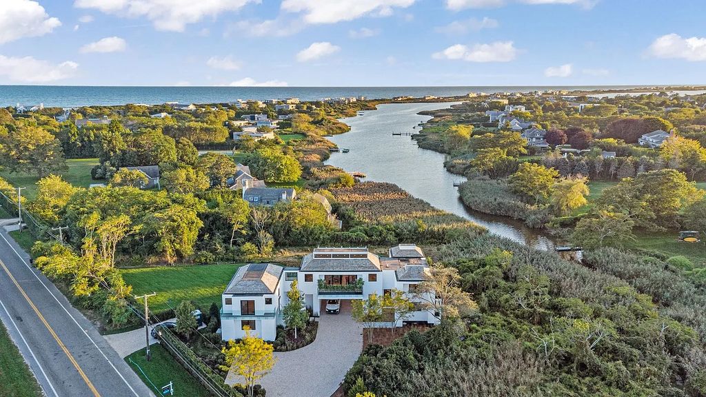 The House in Bridgehampton features an entertainer's floor plan that flows seamlessly into each room with an abundance of natural light, now available for sale. This home located at 1076 Ocean Rd, Bridgehampton, New York