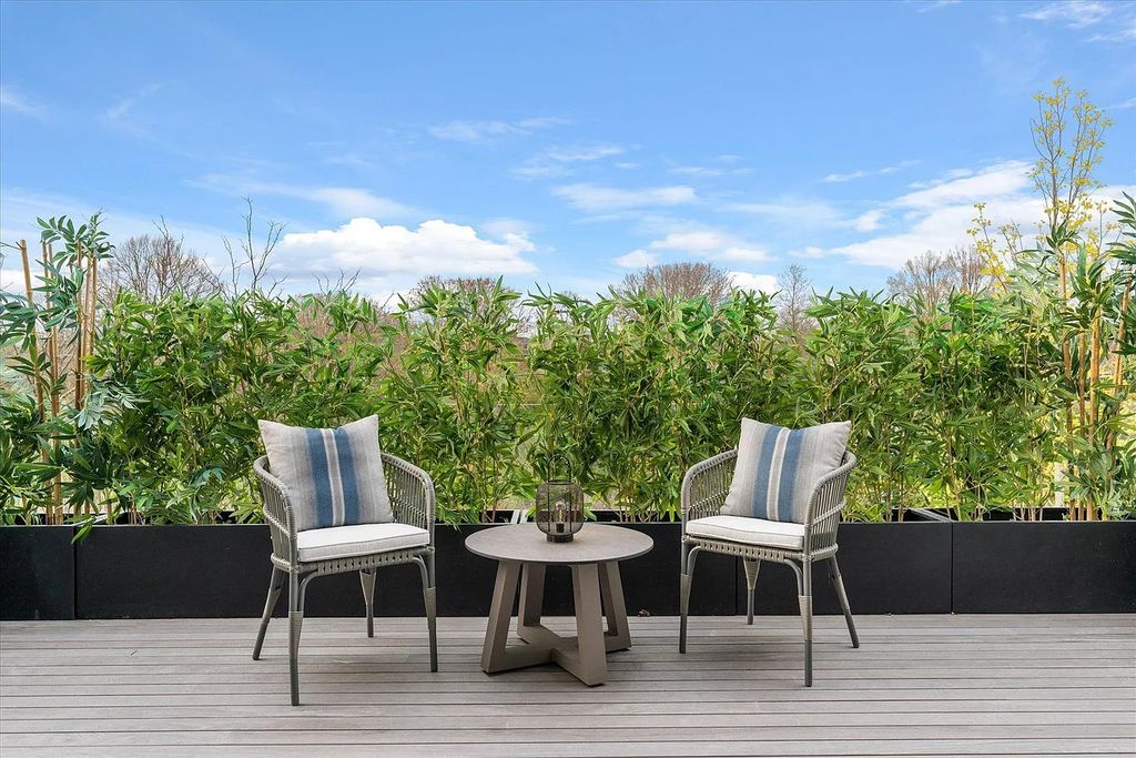 The House in Bridgehampton features an entertainer's floor plan that flows seamlessly into each room with an abundance of natural light, now available for sale. This home located at 1076 Ocean Rd, Bridgehampton, New York