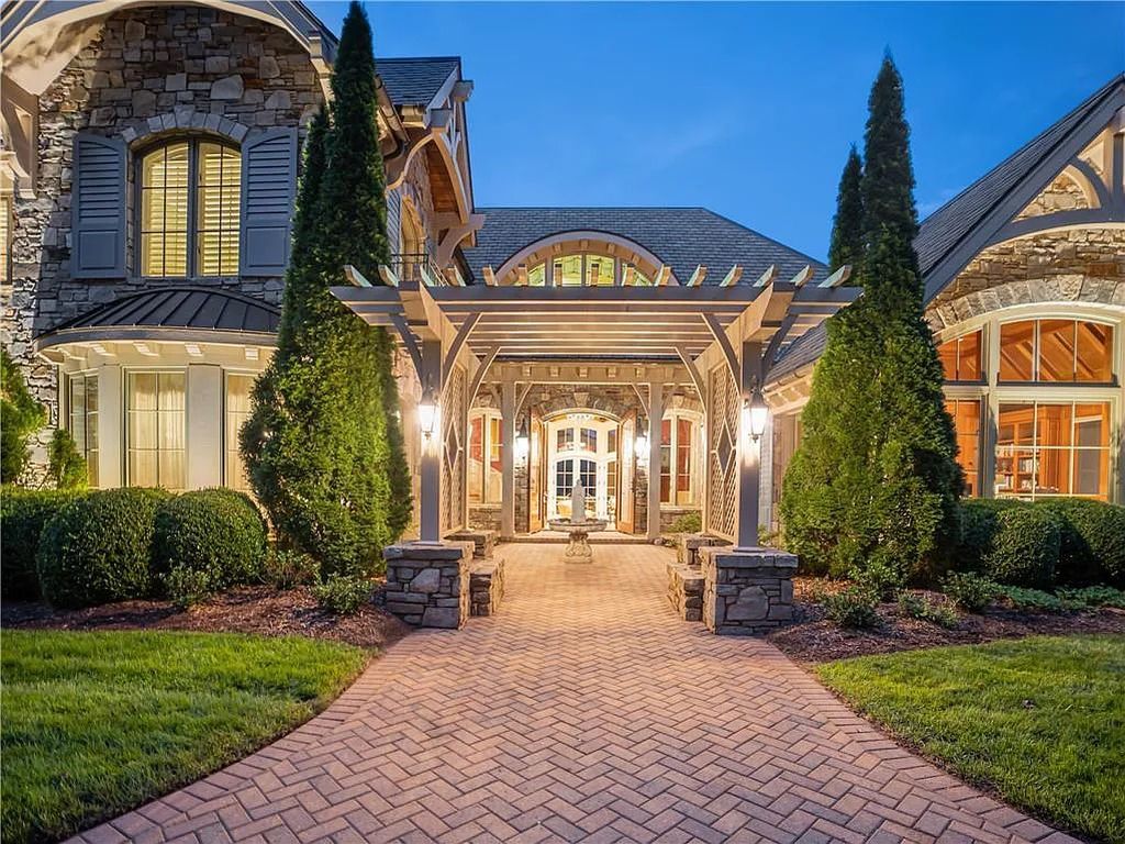 The Estate in Arden offers superb architectural features and radiates timeless elegance, now available for sale. This home located at 1322 Fawn Meadow Way, Arden, North Carolina