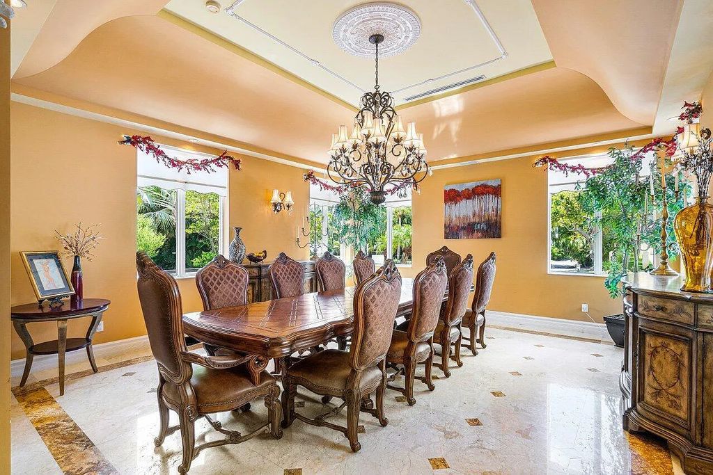 Introducing a stunning house at 14 E Ocean Avenue, located in the highly sought-after area of Boynton Beach, Florida. This luxurious property boasts 6 spacious bedrooms and 7 modern bathrooms, perfect for accommodating large families or hosting guests.