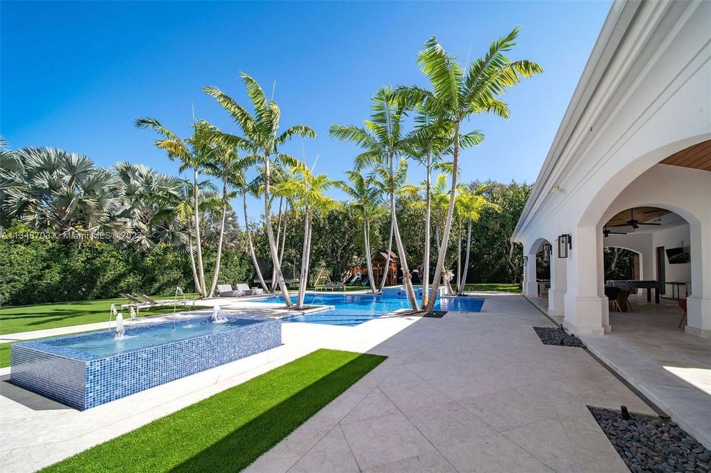 Welcome to 8955 SW 63rd Court in Pinecrest, Florida - an opulent oasis in the sought-after Stritter Estates community. This stunning 6-bedroom, 10-bathroom home boasts over 7,700 square feet of luxurious living space, situated on a sprawling 0.87-acre lot. Built in 2013, this home in Pinecrest is as functional as it is beautiful.