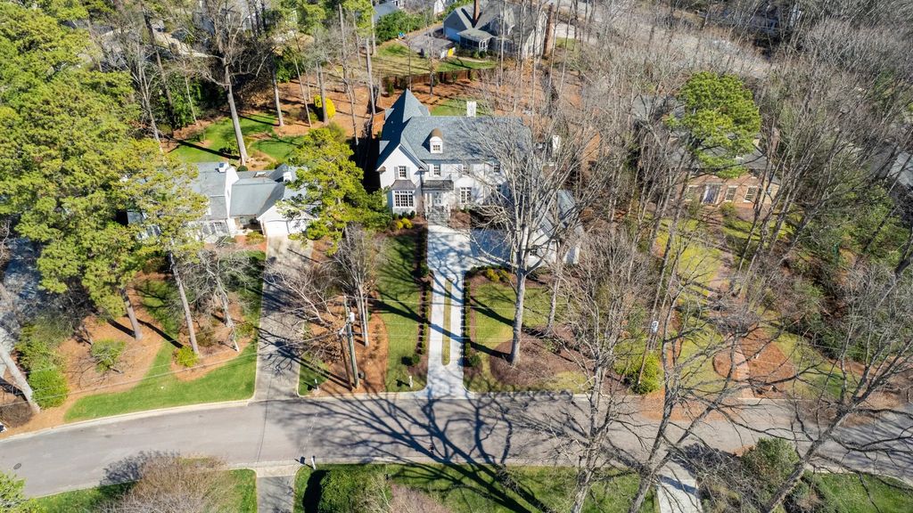 The House in Raleigh has large, beautifully landscaped back yard includes privacy fence, slate patio, and wood-burning fireplace with sitting area, now available for sale. This home located at 3910 Stratford Ct, Raleigh, North Carolina