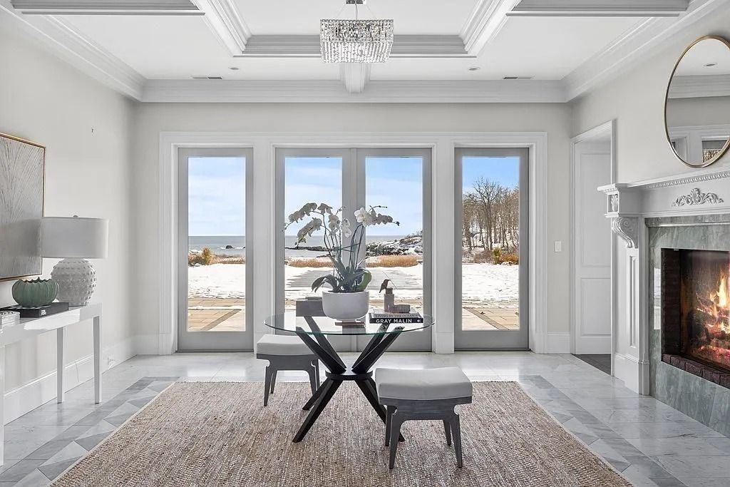 The Manor in Manchester boasts a leisure and entertainment complex with a movie theater, billiard room, and sizable home gym, now available for sale. This home located at 38 Masconomo St, Manchester, Massachusetts