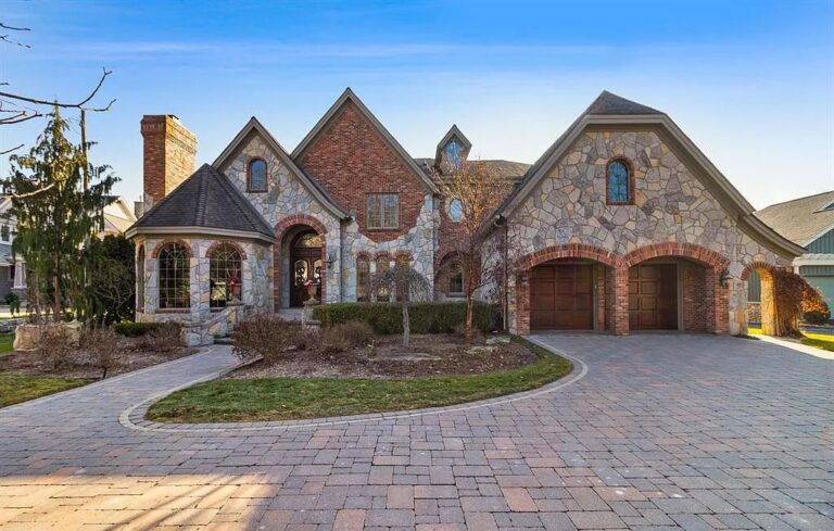 Presenting the Best Lakefront Living, Elegant Stone and Brick Exterior and Gracious Interiors, this Impressive Home in Fenton, MI on Market for $2.899M