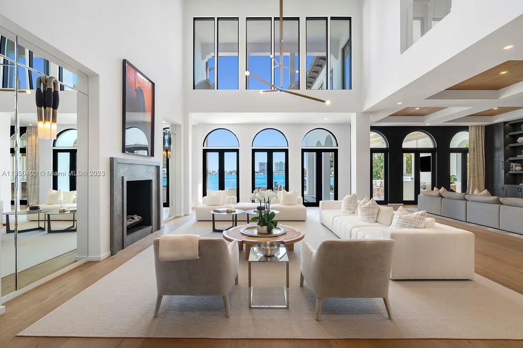 Welcome to 815 E Dilido Drive, Miami Beach, Florida, a stunning transitional home designed by Menin Design. This hme in Miami Beach boasts 6 bedrooms and 8 bathrooms, with a living space of 8,181 square feet, all situated on a spacious 0.31-acre lot. Built in 2006, this home is one of the most impressive properties on the Venetian, offering 107 feet of waterfront living.