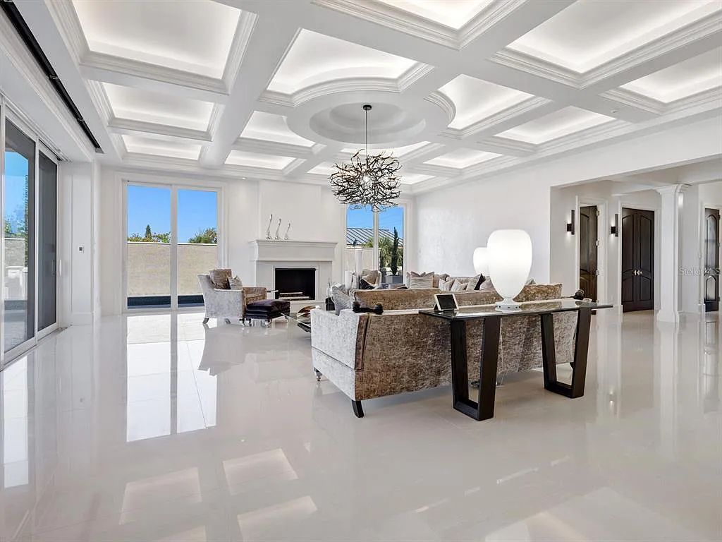 This stunning 2018-built gulf front estate is located at 3909 Casey Key Road in Nokomis, Florida. Boasting 4 bedrooms, 6 bathrooms, and a sprawling living space of 6,335 square feet on a 0.53-acre lot, this refined and elegant home offers breathtaking views of the Gulf of Mexico from the expansive walls of glass.