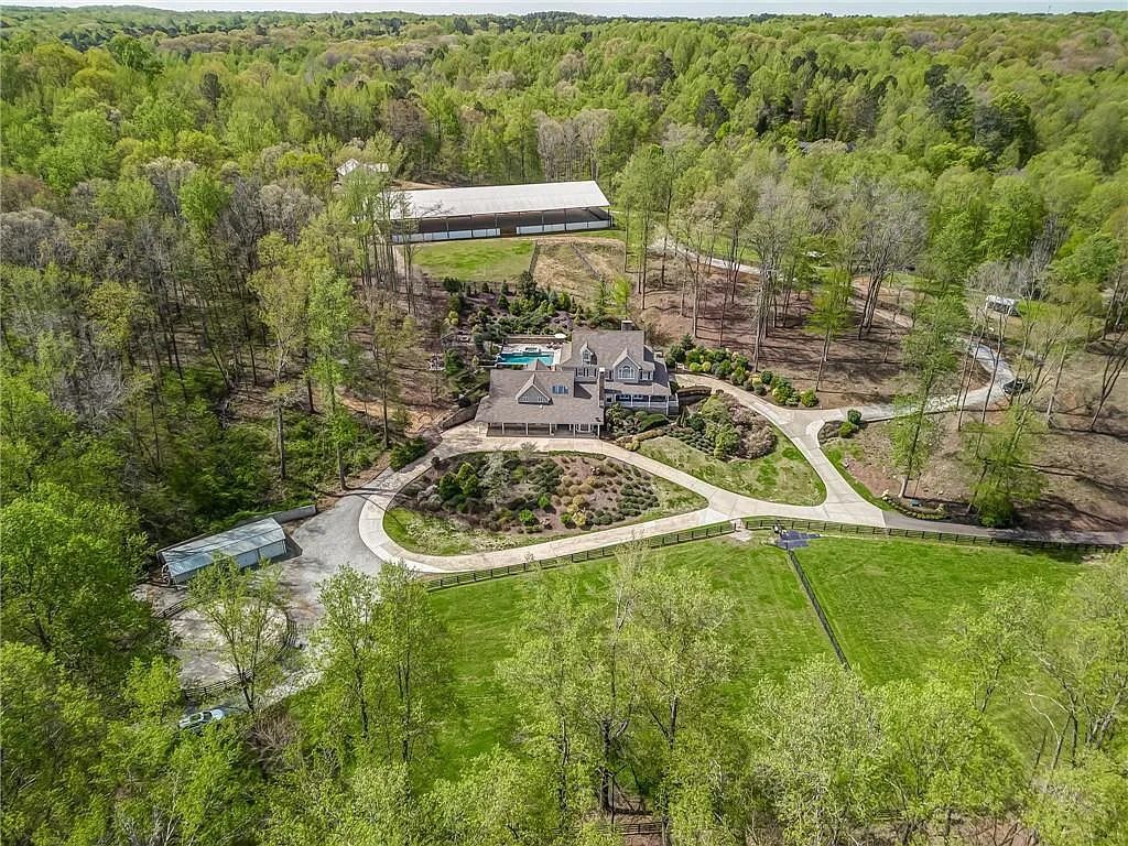 $2.999M Dream Equestrian Property with Endless Features in Canton, GA - A Horse Lover's Paradise!