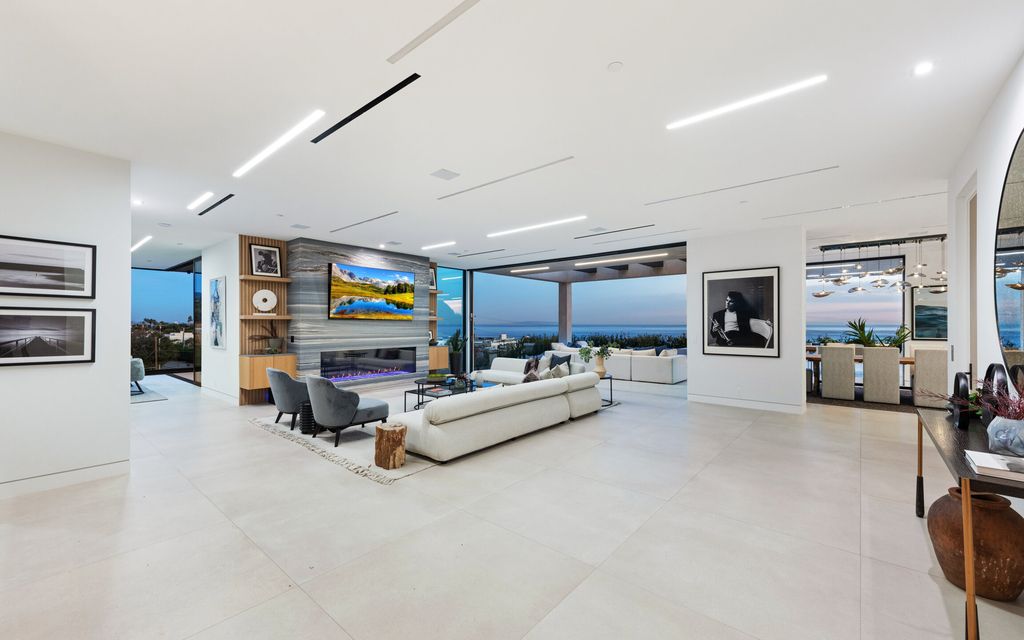 This stunning contemporary residence is located at 23917 Malibu Rd, Malibu, CA 90265, in the gated community of Malibu Colony Estates. The house was built in 2023 and boasts 5 bedrooms, 10 bathrooms, and a living area of 8,200 square feet. The lot size is 1.32 acres, providing ample outdoor space for relaxation and entertainment.