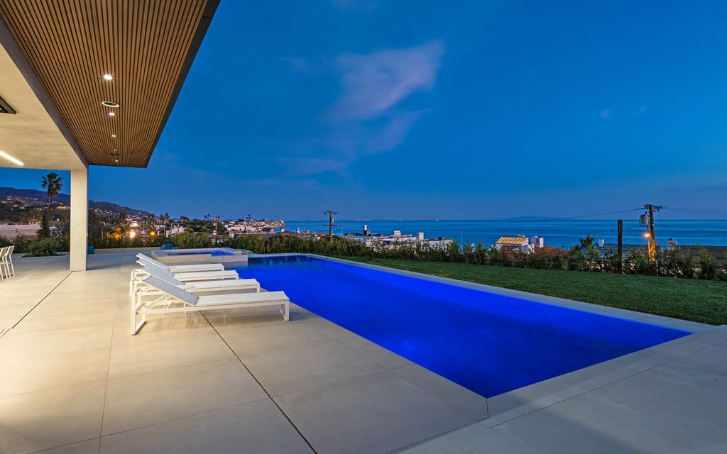 This stunning contemporary residence is located at 23917 Malibu Rd, Malibu, CA 90265, in the gated community of Malibu Colony Estates. The house was built in 2023 and boasts 5 bedrooms, 10 bathrooms, and a living area of 8,200 square feet. The lot size is 1.32 acres, providing ample outdoor space for relaxation and entertainment.