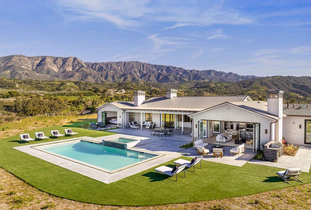 2710 Montecito Ranch Place Home in Summerland, California. Experience the ultimate luxury living with awe-inspiring 360-degree views of the Pacific Ocean, Channel Islands, lush greenbelt, and Santa Ynez foothills from this newly constructed contemporary abode in Montecito Ranch Estates. This single-level residence features 4 ensuite bedrooms, an open concept living and dining room, gourmet kitchen, and family room. Enjoy modern elegance, designer finishes, vaulted ceilings, and seamless indoor/outdoor living with retractable glass doors. Lounge by the pool and embrace a resort-style lifestyle year-round. Don't miss this incredible opportunity!