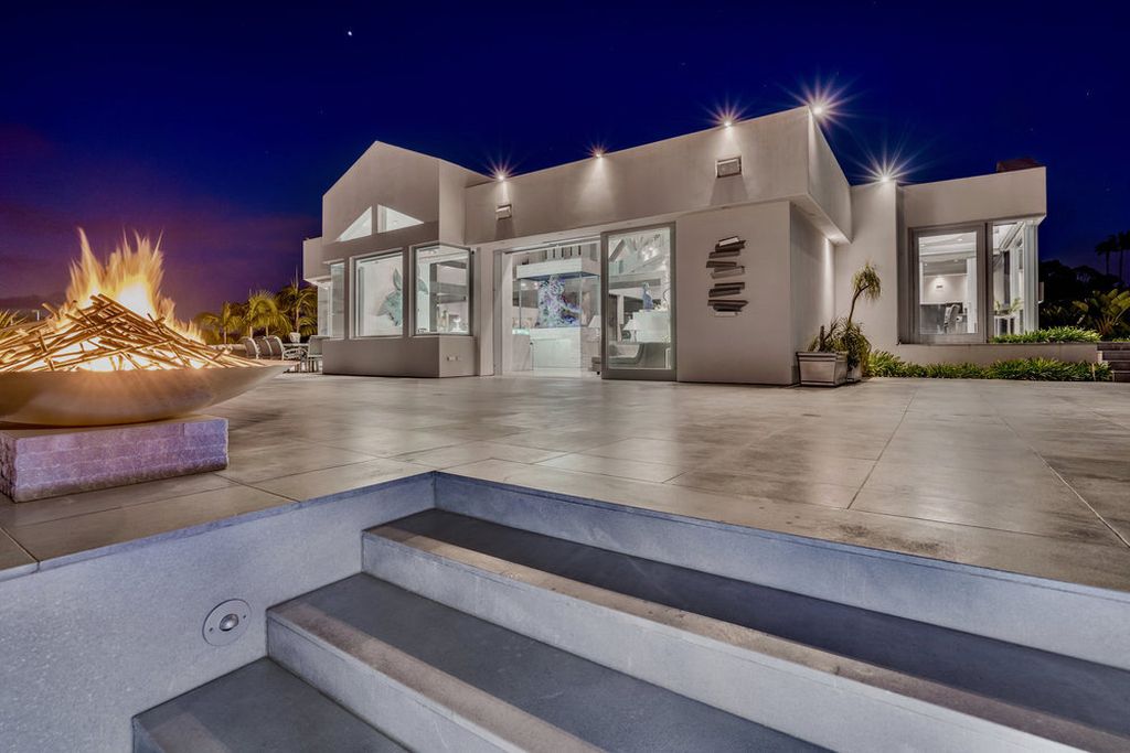 Located at 6002 Via Posada Del Norte in Rancho Santa Fe, CA, this stunning contemporary home is a dream come true. Boasting 12 bedrooms, 10 bathrooms, and a living space of 12,745 square feet, this home is truly one-of-a-kind. Built in 2006, it sits on one of the most coveted lots in the prestigious guard-gated community of Fairbanks Ranch.