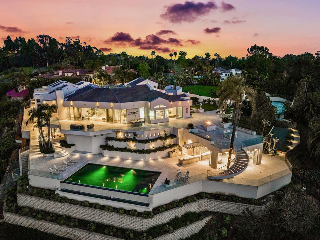 Located at 6002 Via Posada Del Norte in Rancho Santa Fe, CA, this stunning contemporary home is a dream come true. Boasting 12 bedrooms, 10 bathrooms, and a living space of 12,745 square feet, this home is truly one-of-a-kind. Built in 2006, it sits on one of the most coveted lots in the prestigious guard-gated community of Fairbanks Ranch.