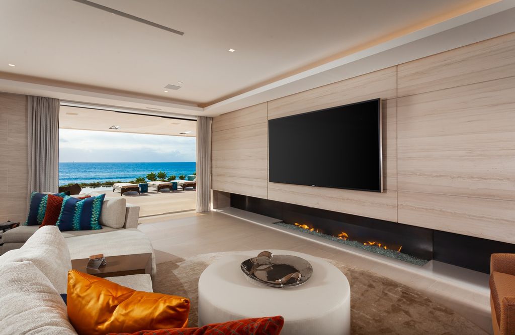 7 Strand Beach Drive in Dana Point, CA is an exquisite property that boasts breathtaking Pacific Ocean views, unparalleled contemporary architecture, and a prime location at The Strand at Headlands. Built in 2018 by Brown Brothers Construction, this modern custom showplace features approximately 9,630 square feet of living space, six ensuite bedrooms, and seven-and-a-half baths, including two primary suites and a junior suite on the top level.