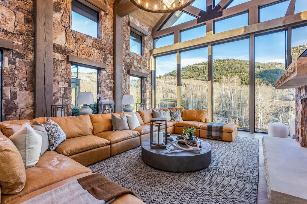 7600 E Deer Knoll Drive Home in Heber City, Utah. This custom-built home in Lashbrooke community offers a functional floor plan and ideal space for entertaining. With a main-level primary bedroom, gourmet kitchen, and great room opening to the keeping room, this home is perfect for hosting guests.