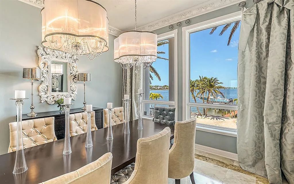 Welcome to a stunning Siesta Key coastal home 1414 Point Crisp Road, Sarasota, Florida with 360-degree bay views and 546 feet of waterfront on Little Sarasota Bay. This 6-bed, 9-bath home boasts 7,162 sqft of living space on 1.22 acres of land.