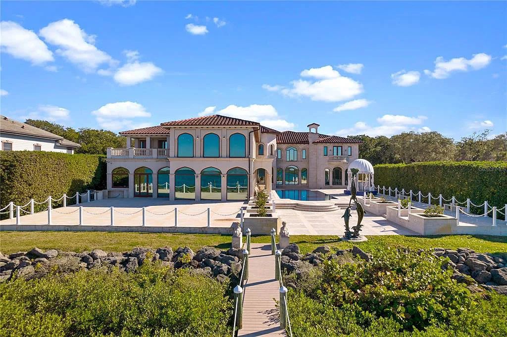 Discover the ultimate in luxury living at 4852 S Peninsula Drive in Ponce Inlet, Florida. This privately gated 3-acre waterfront estate boasts 6 bedrooms, 9 bathrooms, 12,126 sq ft of living space, and a 2.80-acre lot size built in 2004.