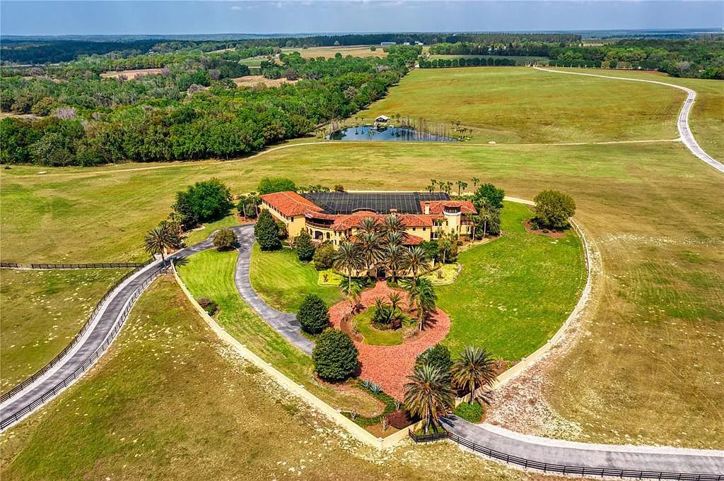 Don't miss the chance to own an authentic Hacienda-style home 33642 Blanton Road on 1.99 acres of land in Dade City, Florida. This luxurious 5 bed, 8 bath estate features Smart Home technology, bespoke cabinetry, and a Pebble Tec lagoon-style pool. It also includes a two-story Cypress Barn and is conveniently located near I-75 for easy access to Tampa and Orlando.