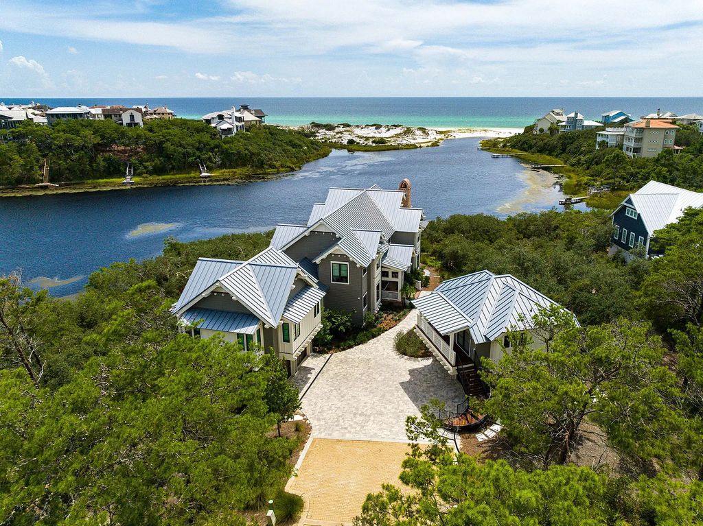 Discover the breathtaking Frank Lloyd Wright inspired masterpiece at 58 Sinclair Lane, Santa Rosa Beach, Florida. Boasting 5 bedrooms, 6 bathrooms, and 4,752 square feet of luxurious living space, this modern home offers stunning vistas of Draper Lake and the Gulf of Mexico.