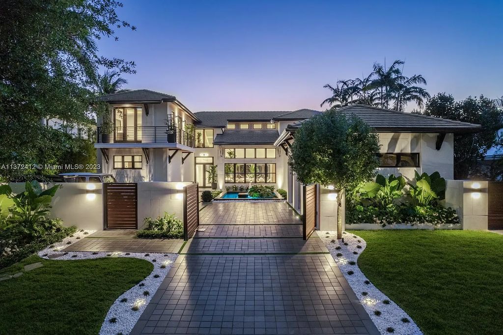 Introducing Casa Exumas, a luxurious 6-bed, 7-bath waterfront residence with 5,715 sq ft of living space on a 0.35-acre lot in 4241 Palm Lane, Miami, Florida.