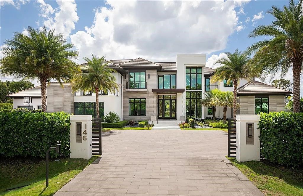 146 Myrtle Road, Naples, Florida newly completed, custom contemporary Pine Ridge estate boasts 6 beds, 10 baths, 7,238 sq ft of living space on a 1.21-acre lot.