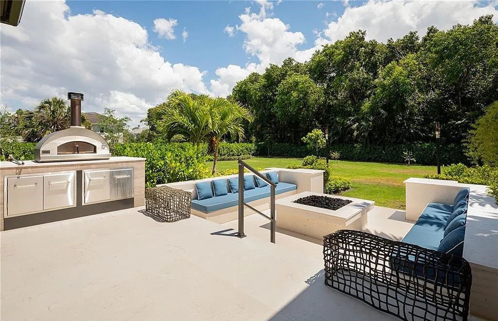 146 Myrtle Road, Naples, Florida newly completed, custom contemporary Pine Ridge estate boasts 6 beds, 10 baths, 7,238 sq ft of living space on a 1.21-acre lot.