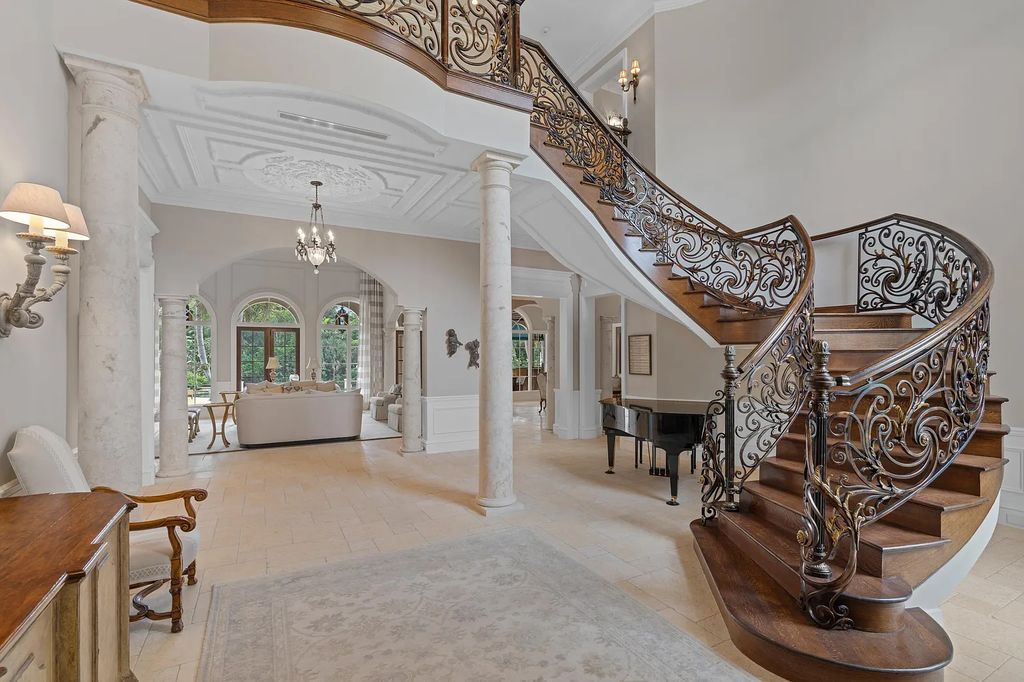 This gated estate in 166 W Alexander Palm Road, Boca Raton, Florida boasts 7 bedrooms, 11 baths, and 11,799 sqft of living space. Enjoy 150' of waterfront property overlooking the Royal Palm Waterway and Capone Island's lush landscape.