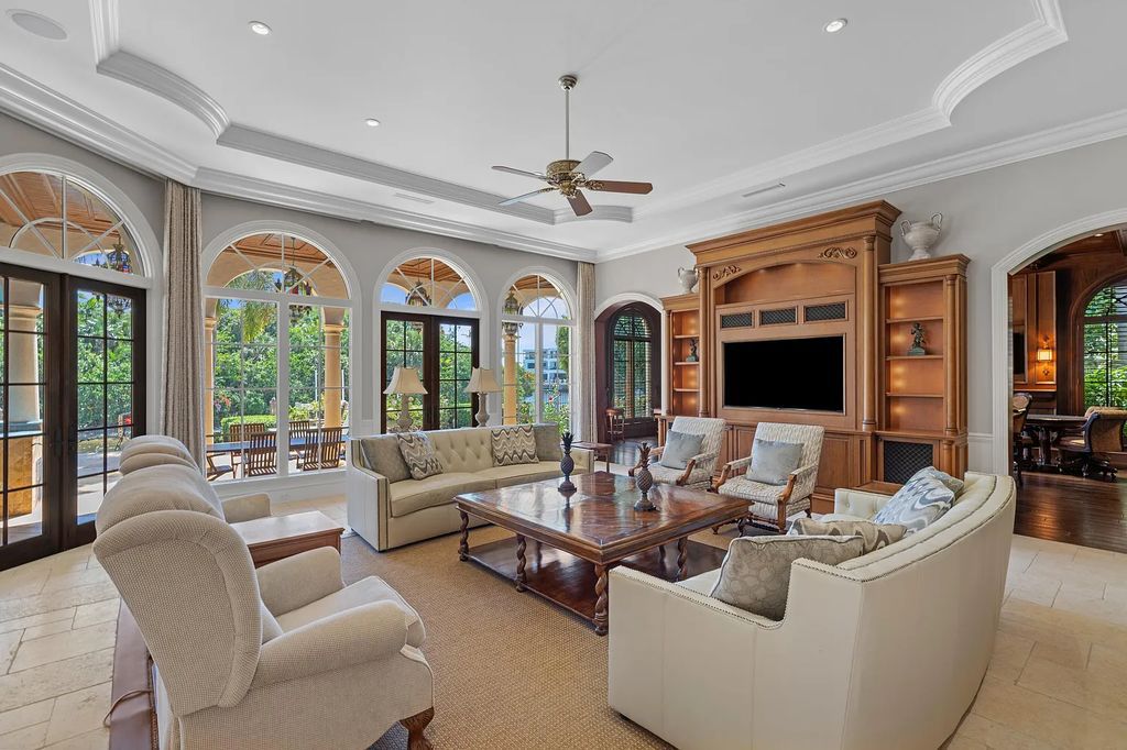 This gated estate in 166 W Alexander Palm Road, Boca Raton, Florida boasts 7 bedrooms, 11 baths, and 11,799 sqft of living space. Enjoy 150' of waterfront property overlooking the Royal Palm Waterway and Capone Island's lush landscape.