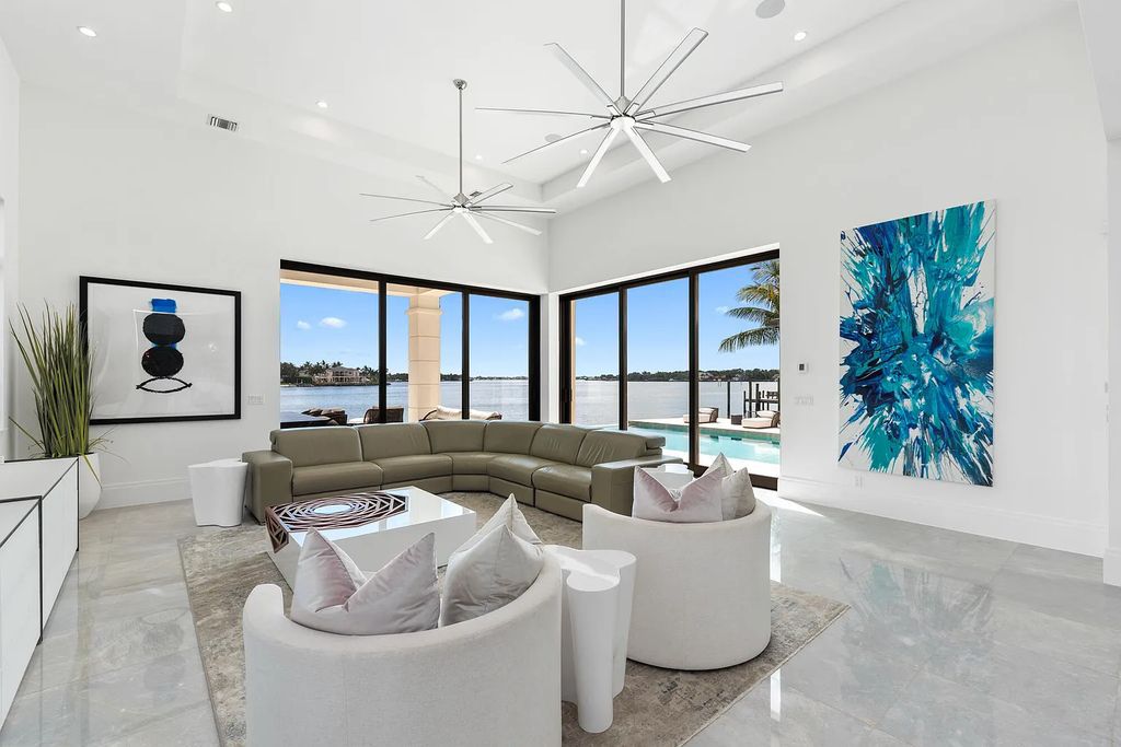 Welcome to 8 Bamboo Lane, Jupiter, Florida, a luxurious contemporary British West Indies home. Built in 2016, this 4-bed, 8-bath, 6,599 sq ft home boasts modern flair and luxury finishes throughout. With 200' of riverfront, it offers breathtaking water views from every room.