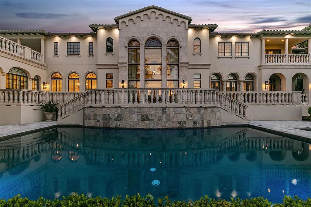Experience luxury living at 5507 Worsham Court in Windermere, Florida. This stunning custom estate offers 5 beds, 9 baths, and an expansive living space of 10,200 sqft, overlooking the 14th green of Isleworth Golf and Country Club.