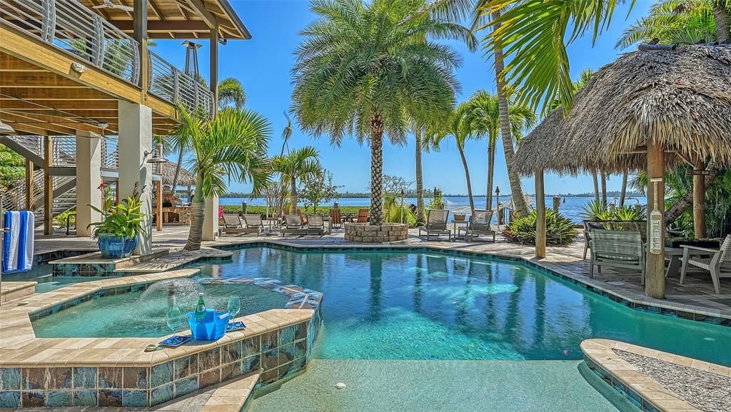 Experience luxury waterfront living at its finest with this stunning custom estate in 10216 46th Avenue W, Bradenton, Florida.