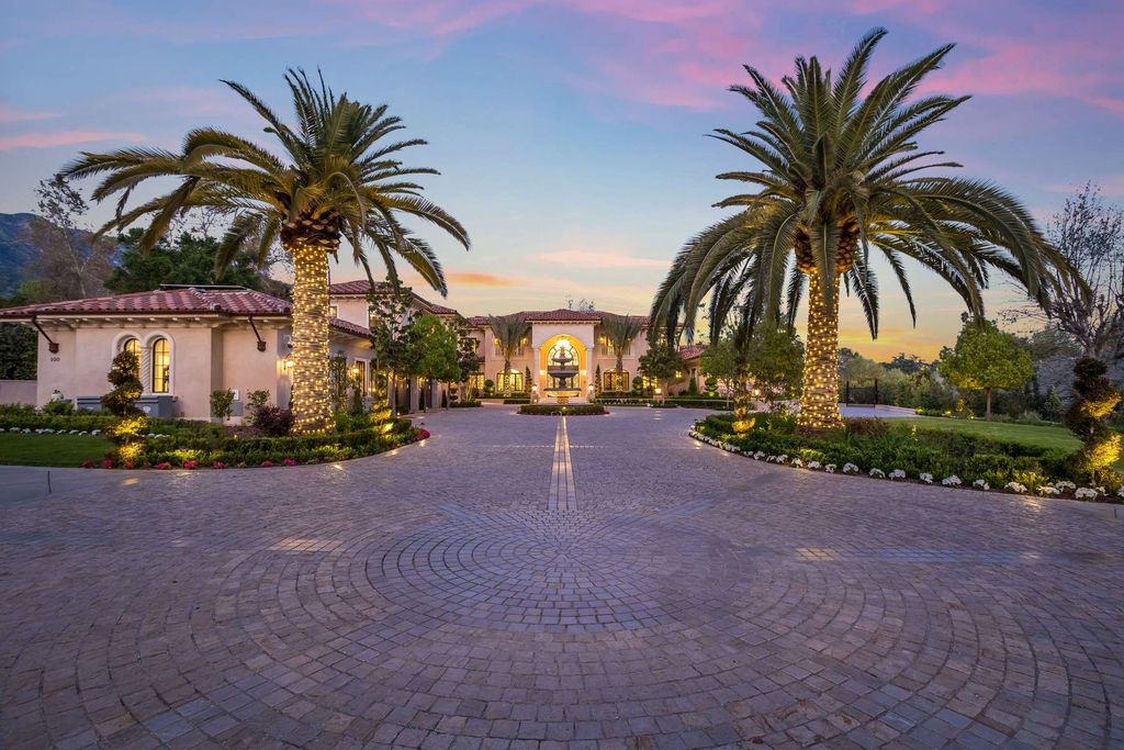100 Palm Hill Lane Home in Bradbury, California. This stunning Tuscan-style estate located in Bradbury Estates boasts luxurious materials imported from Italy, including marble flooring, chandeliers, and embroidered wallpaper. The property also features an advanced home automation system and a self-sufficient energy system. 
