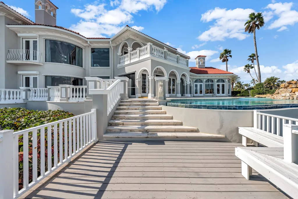 100 Seaway Court Home in Vero Beach, Florida. Discover the unparalleled beauty of this Palm Beach-inspired oceanfront estate, situated on an expansive 3± acre lot boasting an impressive 326± feet of direct ocean frontage. With a total living area of 13,878± square feet, this remarkable residence offers 6 bedrooms, 6 full bathrooms, and 2 half baths.