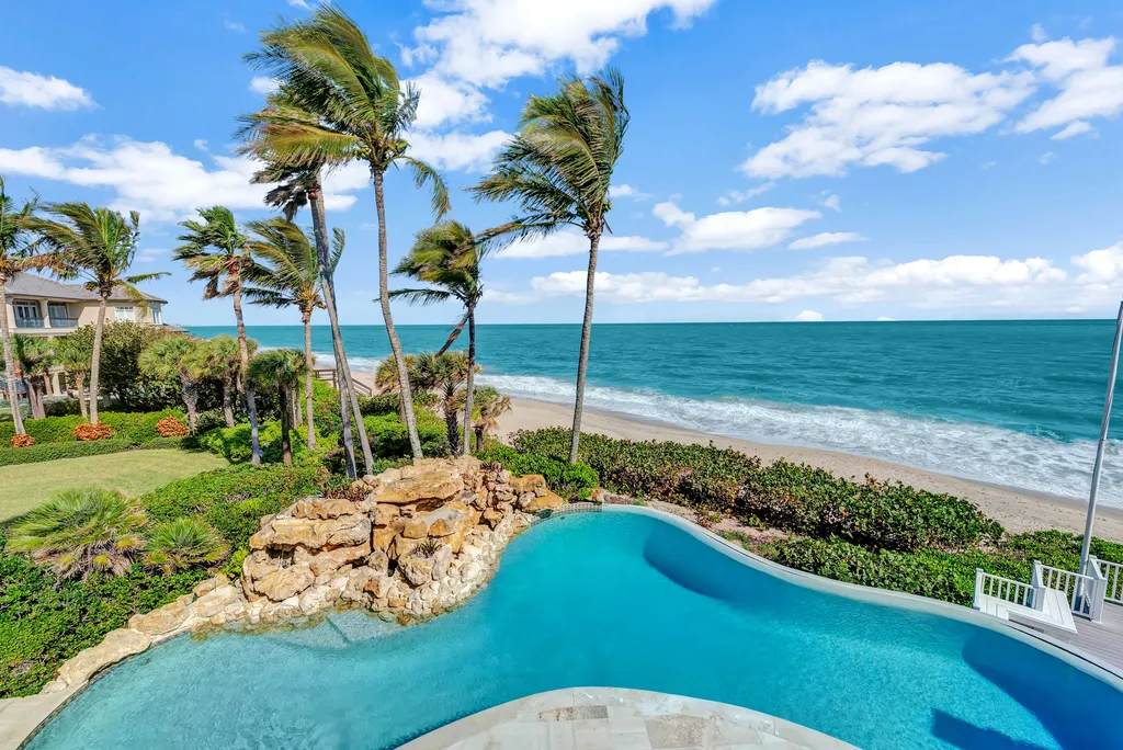 100 Seaway Court Home in Vero Beach, Florida. Discover the unparalleled beauty of this Palm Beach-inspired oceanfront estate, situated on an expansive 3± acre lot boasting an impressive 326± feet of direct ocean frontage. With a total living area of 13,878± square feet, this remarkable residence offers 6 bedrooms, 6 full bathrooms, and 2 half baths.