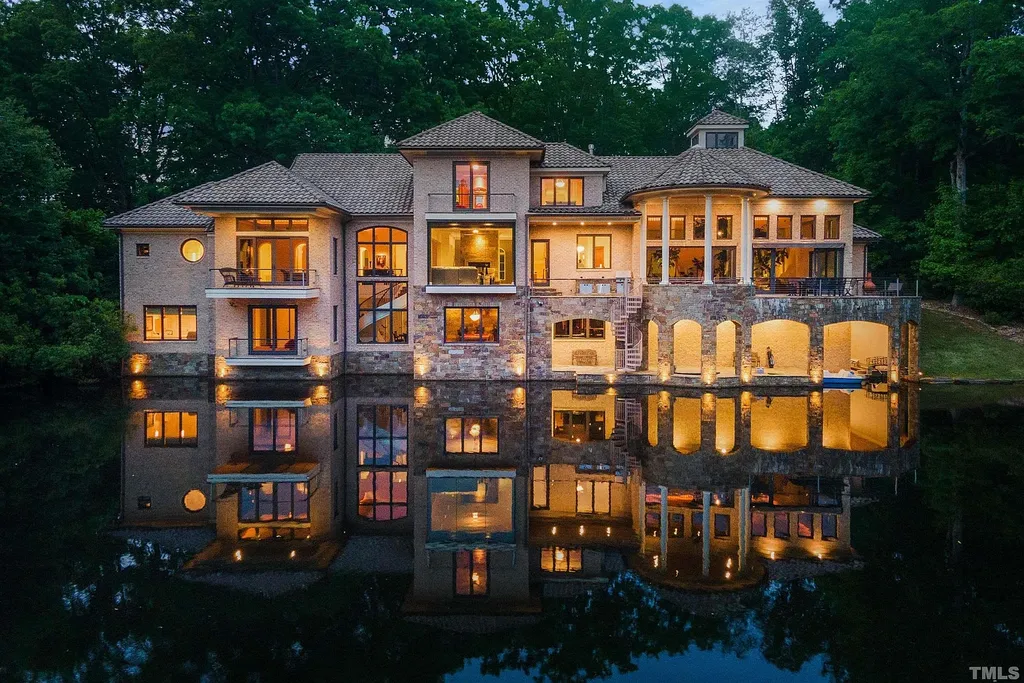 This stunning property located at 102 Anna Lake Ln, Cary, NC offers an exceptional lakeside living experience on nearly 8 acres of land. Situated on a private lake, this magnificent estate is just a short drive away from downtown Cary, hiking trails, and other amenities. With its close proximity to RTP and RDU Airport, commuting is a breeze. 