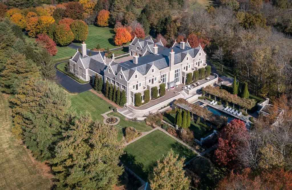 1202 Delong Place Home in Lexington, Kentucky. Indulge in the opulent Lexington lifestyle in this fabulous 10-bedroom, 13-bath Estate, offered lavishly furnished. Completed in 2001, this magnificent home is constructed of steel, concrete, and Indiana limestone. Known as the Delong Manor, it boasts over 50 rooms and is believed to be the largest home in Lexington and the entire state of Kentucky, offering an estimated 28,000-plus square feet of living space. This exceptional Estate is truly one of a kind!