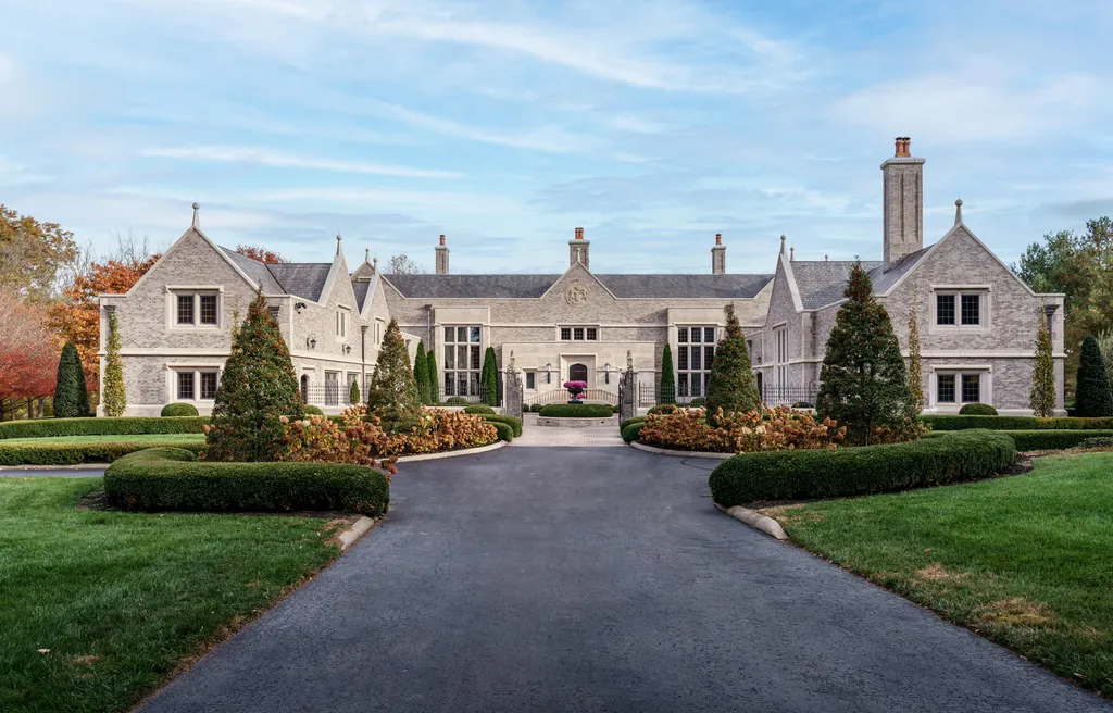 1202 Delong Place Home in Lexington, Kentucky. Indulge in the opulent Lexington lifestyle in this fabulous 10-bedroom, 13-bath Estate, offered lavishly furnished. Completed in 2001, this magnificent home is constructed of steel, concrete, and Indiana limestone. Known as the Delong Manor, it boasts over 50 rooms and is believed to be the largest home in Lexington and the entire state of Kentucky, offering an estimated 28,000-plus square feet of living space. This exceptional Estate is truly one of a kind!