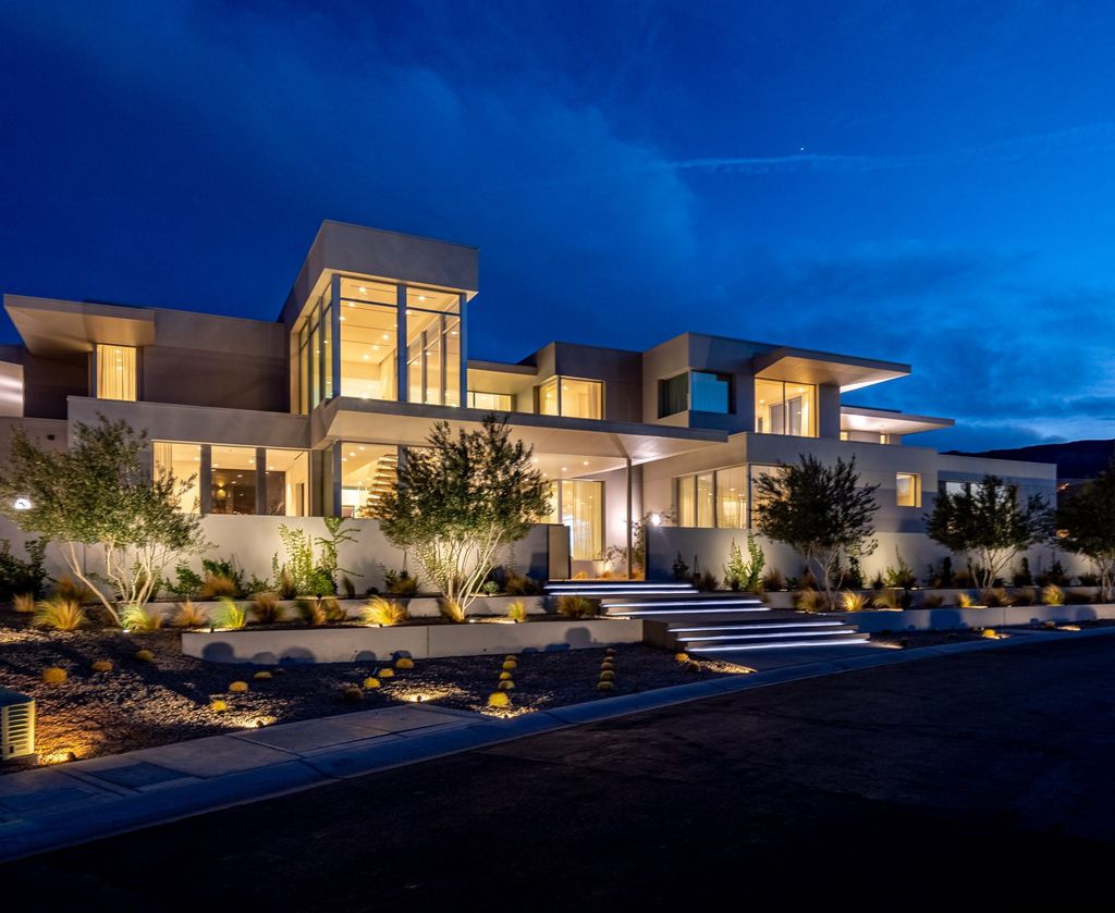 14 Magic Stone Lane Home in Las Vegas, Nevada. This stunning property boasts six spacious bedrooms, ten opulent bathrooms, and an enormous 12-car garage. The home's architecture is truly noteworthy, with natural stone used for the main kitchen countertop, fireplaces, shower slabs, and accent walls, adding to the lavish ambiance.