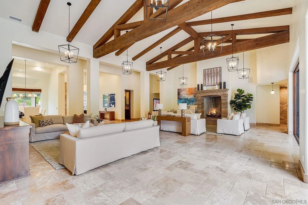16109 Rambla De Las Flores Home in Rancho Santa Fe, California. The property is situated on 2.7 acres of land and features a detached guest house with a kitchen, as well as a master retreat with a private patio overlooking the pool, spa, and grounds. 
