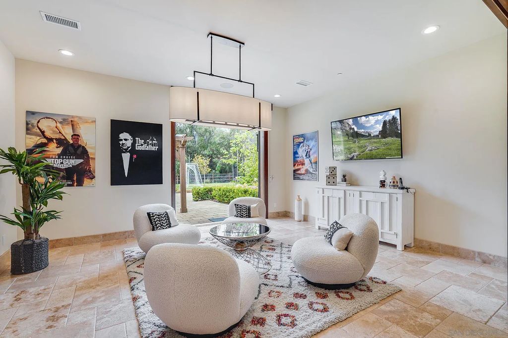 16109 Rambla De Las Flores Home in Rancho Santa Fe, California. The property is situated on 2.7 acres of land and features a detached guest house with a kitchen, as well as a master retreat with a private patio overlooking the pool, spa, and grounds. 