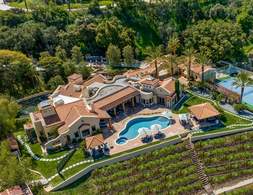 16405 Mulholland Drive Home in Los Angeles, California. This Richard Landry-designed estate is a luxurious property located on a gated promontory on Mulholland Drive. With 4 bedrooms and 7 bathrooms, the home boasts state-of-the-art technology and superior materials throughout. 